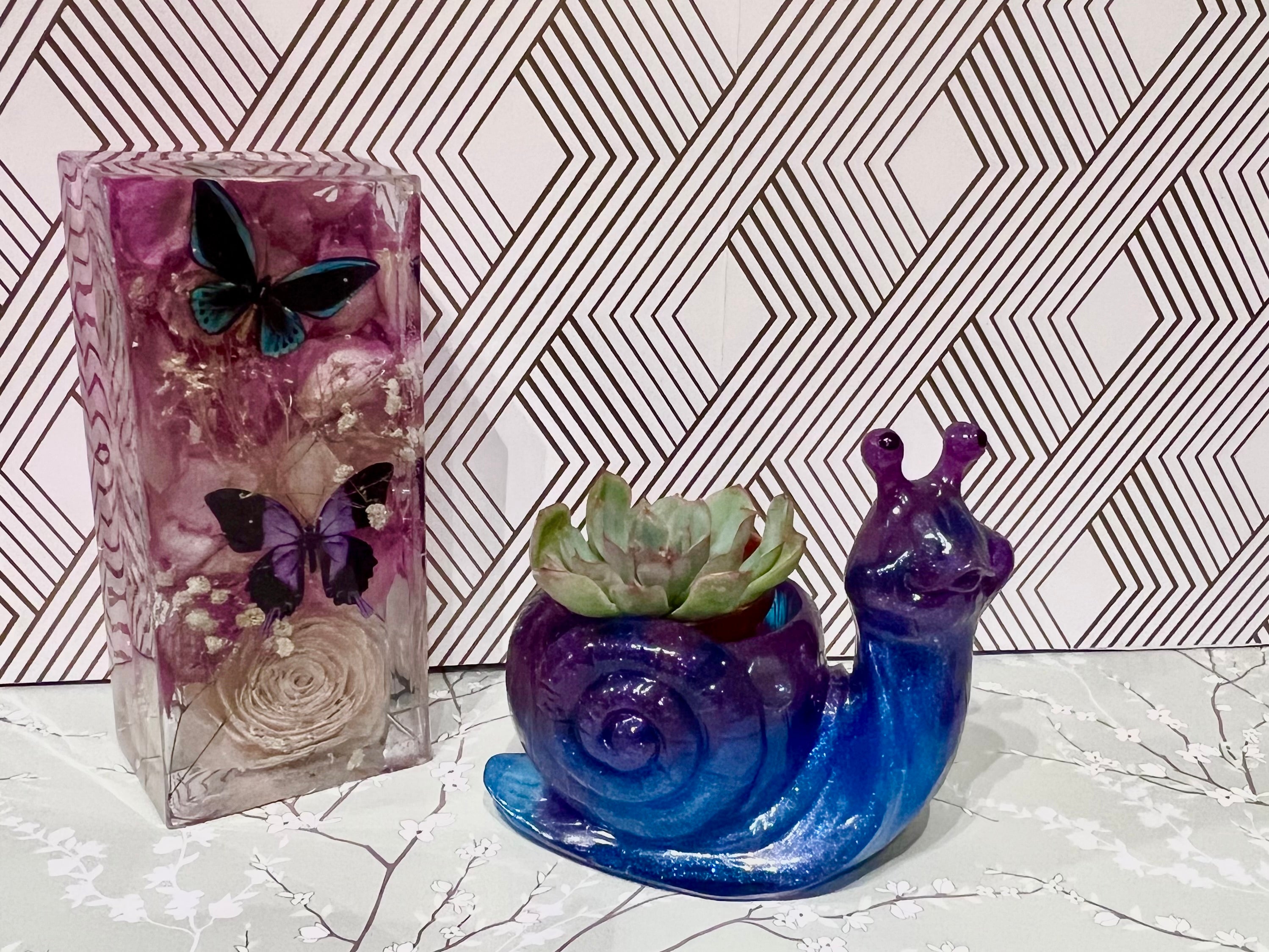A beautiful resin Snail succulent pot